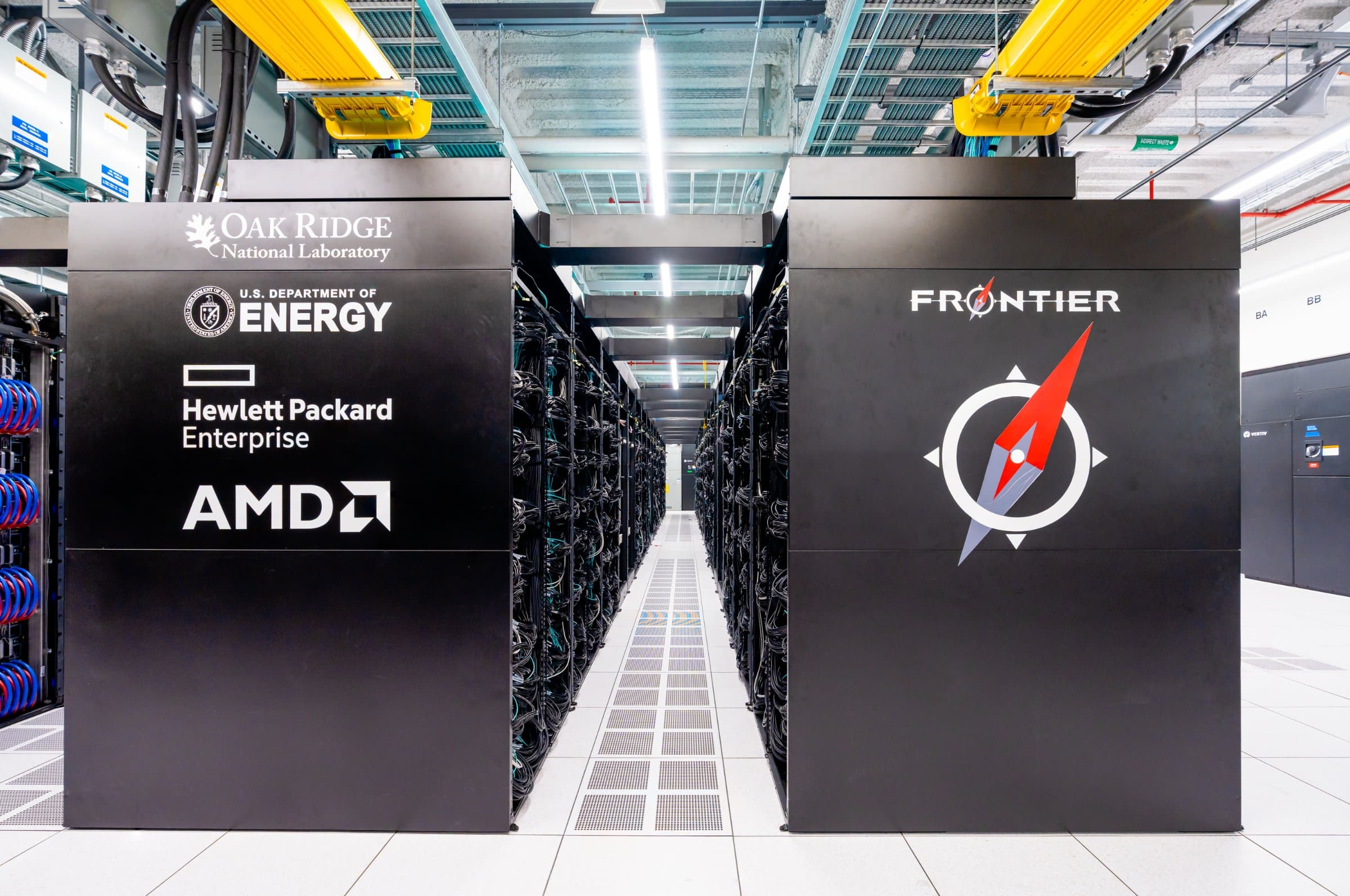 The main aisle of racks in the Frontier exascale supercomputer at Oak Ridge National Laboratory