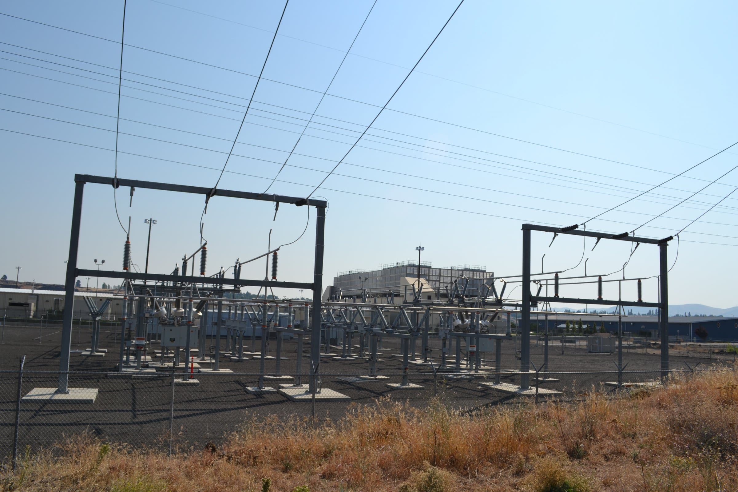 Google data center in The Dalles, Oregon, behind a high-voltage substation and transmission towers